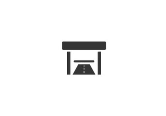 A dark gray icon of a toll booth with a road leading through it set against a white background