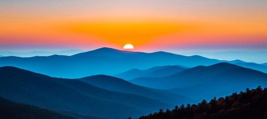 Stunning Sunset Over Majestic Blue Mountain Peaks, Casting a Warm Glow on the Serene Landscape