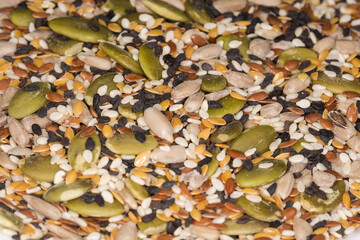 Heap of mix of different raw peeled seeds, selective focus