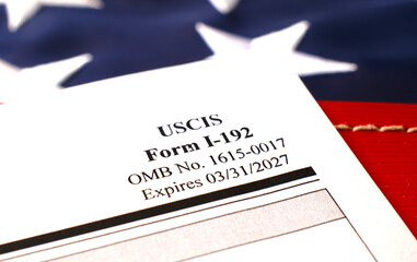 I-192 Application for Advance Permission to Enter as a Nonimmigrant blank form lies on American...