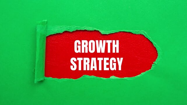 Growth Strategy message writing on ripped torn paper background