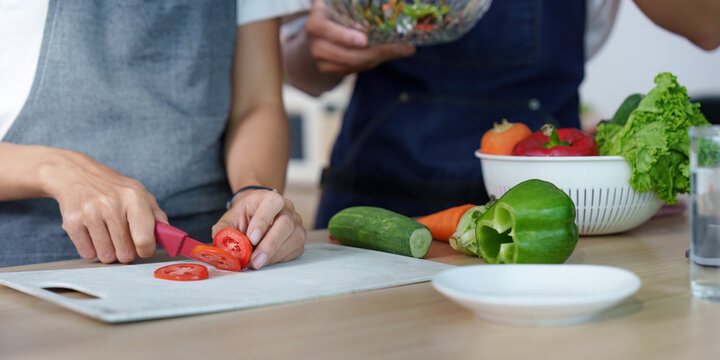 Couple Preparing Fresh Vegetables in the Kitchen