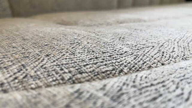 Close up textured sofa fabric surface with detailed upholstery pattern