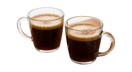 Two clear mugs filled with dark coffee against a dark background