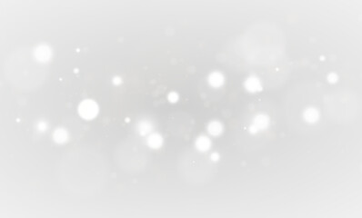 Sparkling golden particles with radiant glow, shiny festive dust and fantasy glitter effect in bright light background for holiday design, card or seasonal illustration.