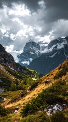 Obraz premium Mountain valley landscape under a stormy sky