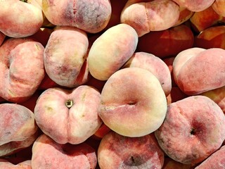 Fruits. Box of peaches in the supermarket