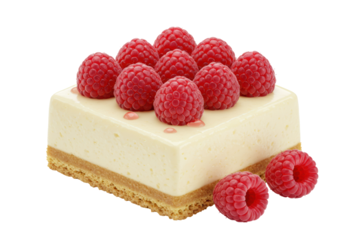 Isolated raspberry cheesecake square topped with berries with two berries aside for serving