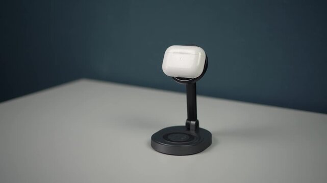 wireless headphones are placed on a magnetic