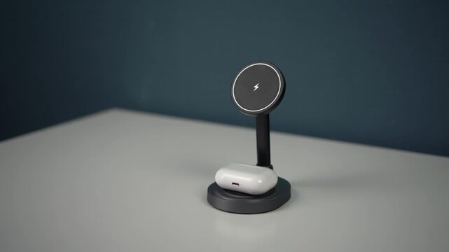 wireless headphones are placed on a magnetic charg