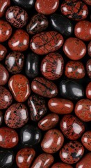 Polished red and black tumbled stones create a captivating visual display.