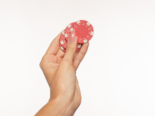 Female hands with poker chips on a white background isolated with empty space for text