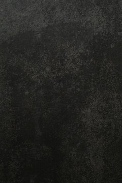 Dark concrete background. Black textured wall 