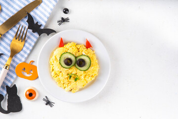 Halloween breakfast scrambled eggs in form of monster