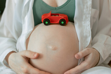 Pregnant Woman  with a  little toy car, Preimplantation genetic diagnosis