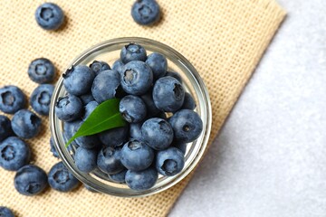 Bowl with fresh blueberries on the table