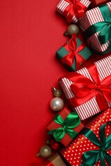 Festive Christmas composition with gift boxes and decorations, top view
