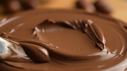 Spreading Creamy Chocolate Hazelnut Paste with a Knife Close Up. - Powered by Adobe