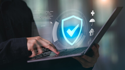 Concept of digital insurance and data protection with glowing shield checkmark on laptop, symbolizing online policy management, secure claims, health, home, life, and financial insurance solutions.