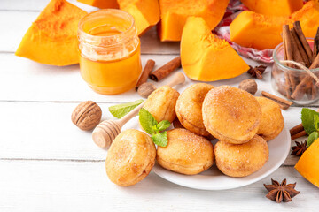 Autumn pumpkin pie donuts with cinnamon sugar sprinkled topping