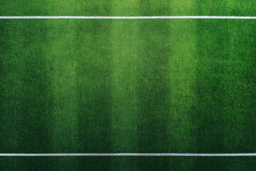 Top down view of lush green sports field with white lines, vibrant grass texture, outdoor stadium, fresh and well maintained, perfect for athletic activities and energetic games