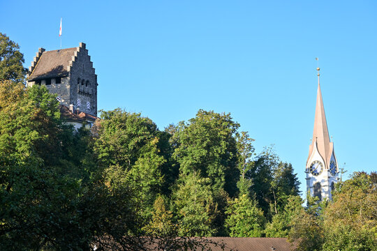 Morning view of Uster, with the iconic Uster Castle tower and the church steeple rising above the trees