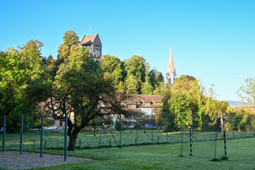 Morning view of Uster, Switzerland, with the iconic Uster Castle tower and the church steeple rising above the trees © S J Lievano