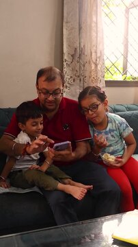 Family taking selfie in living room