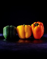 green peppers on black background