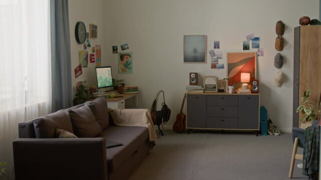 Wide angle shot of modern home interior with clutter focus on couch in foreground, no people, copy space