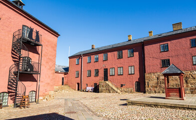Old medieval red brick house in the courtyard of the  fortress Varberg, Sweden