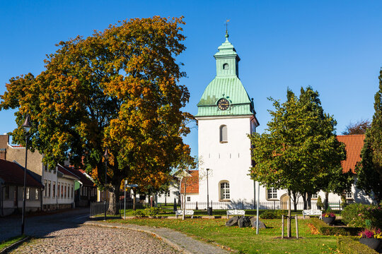 Saint Lawrence Church among colorful trees in Falkenberg, Sweden in autumn