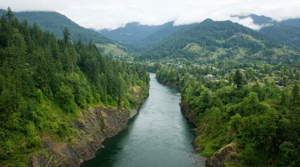 Scenic River Flowing Through Lush Green Mountains Landscape
