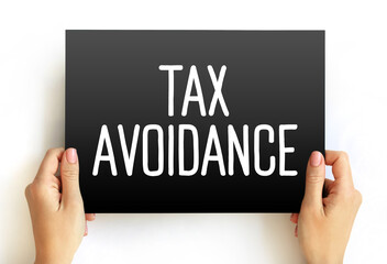 Tax Avoidance is the use of legal methods of reducing taxable income or tax owed, text concept on card