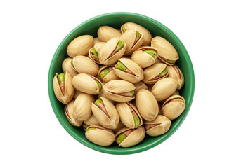 Isolated pistachio nut kernel seeds in green bowl tasty salted snack food close-up