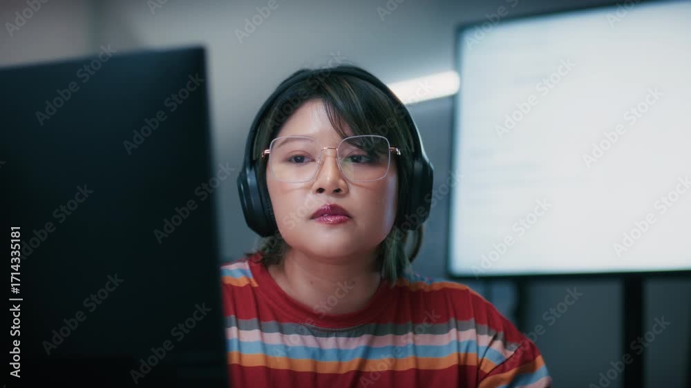 Wall mural asian female software developer concentrating on programming artificial intelligence, writing and de