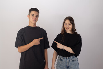 Man and woman in black shirts standing next to each other