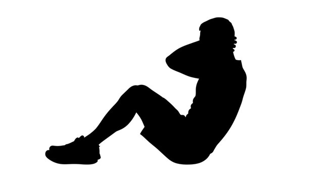 Silhouette of a person doing sit-ups for fitness training and core strength
