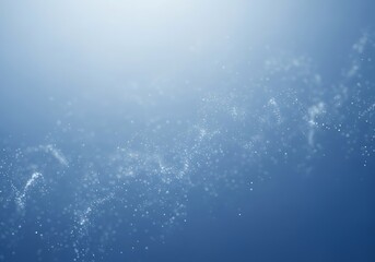 Underwater sunlight rays shimmering through deep blue ocean water aquatic scene.