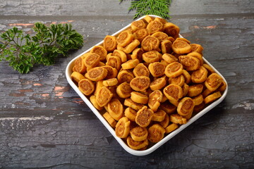 Bowl of Indian sweet snack - bhakarwadi.  