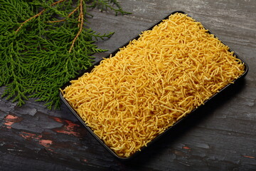 Deep fried savoury snack  sev- om podi North Indian snack food.