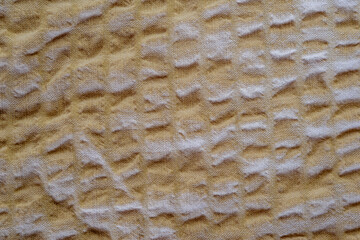 close-up of a textured beige cotton fabric