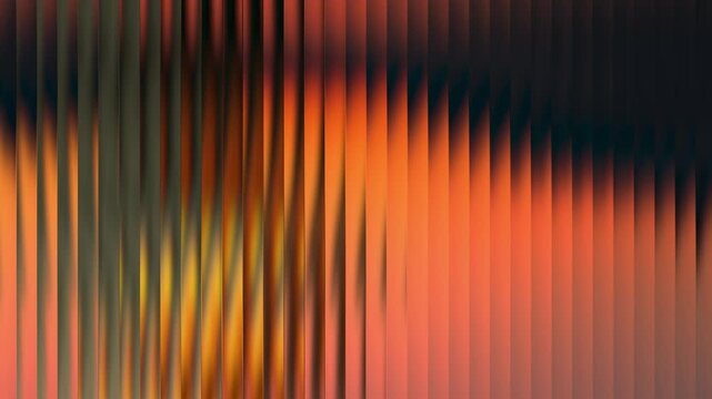 Warm and moody abstract background with a fiery orange, red, and yellow gradient on dark vertical lines. An atmospheric, cinematic seamless loop animation evoking a sunset or fire in 4K.

