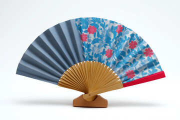 Colorful fan displayed on a wooden stand with unique designs