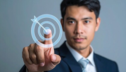 Futuristic digital target icon touched by businessman hand symbolizing vision