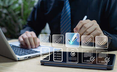Businessman using smart technology for digital data verification, reviewing documents with check marks to represent validation, compliance, approval process, and workflow efficiency.