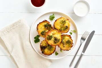 Healthy loaded egg muffins made with eggs, bacon, broccoli, cheese