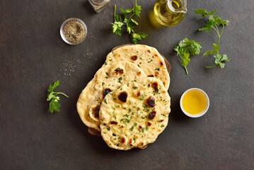 Indian naan bread with greens and garlic butter