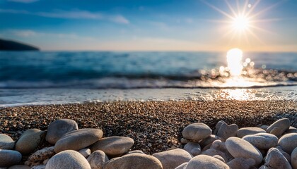 Smooth Pebbles On A Beach With The Sea In The Background And Sunlight Creating Bokeh Effects On The Water