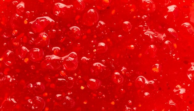Close-up red fruit jam texture